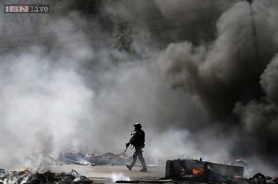 Ceasefire in east Ukraine frays, woman killed by shelling