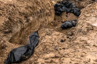 In Bucha, Bodies Protrude From A Mass Grave In A Churchyard, Shrinking Space For Peace Talks