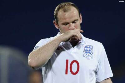 Rooney stays with England despite allegations