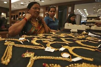 Gold hits another record, demand plunges