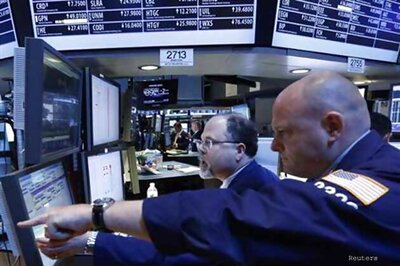 Drop in Apple shares, weak profits drag Wall Street lower