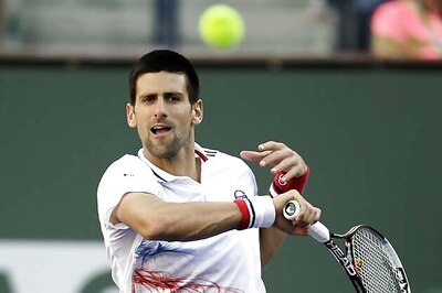 Defending champ Djokovic advances at Wimbledon