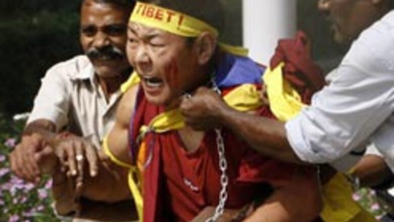 Tibetans barge into China embassy, paint slogans