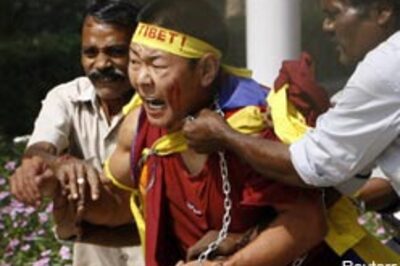 Tibetans barge into China embassy, paint slogans
