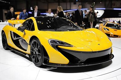 Ferrari and McLaren unveil hybrid supercars