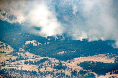 Amid Jaw-Dropping Record High Temperature, Raging Fires Char Canada Town; 1,000 Shifted