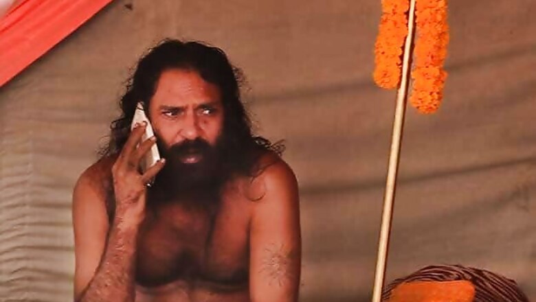 Snapshot: The sadhu who loves his cellphone
