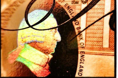 Bank of England cuts UK growth forecasts, holds rates