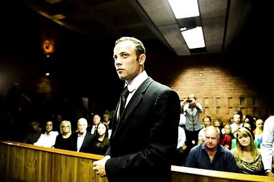 Pistorius weeps in court, murder trial set for March 2014