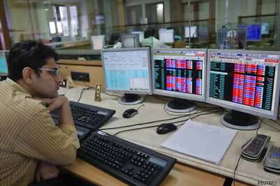 Sensex loses 590 points; rupee at 66.07 vs dollar