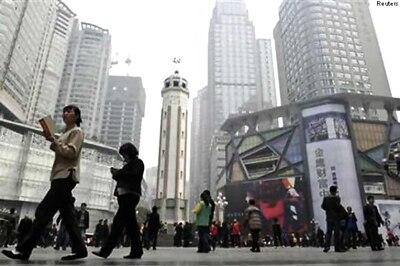 China revises down 2014 GDP growth to 7.3% from 7.4%