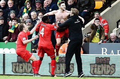 Lallana's injury-time winner helps Liverpool sink Norwich 5-4 in EPL