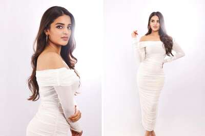 Actress Nidhhi Agerwal Looks Ethereal In White Off-shoulder Body-hugging Dress