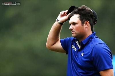 Reed in driver's seat of Cadillac Open as Tiger Woods fades