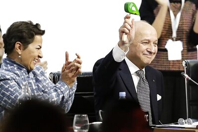 Historic pact to slow global warming is celebrated in Paris