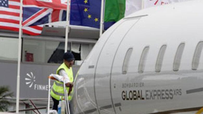 Rain matches gloom at Paris Air Show