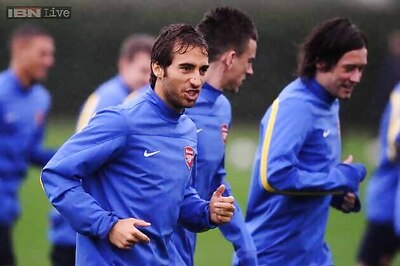 Arsenal's Mathieu Flamini ruled out of Dortmund clash with concussion