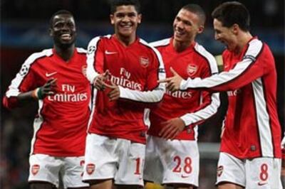 Own goal saves United, Rosicky rescues Arsenal