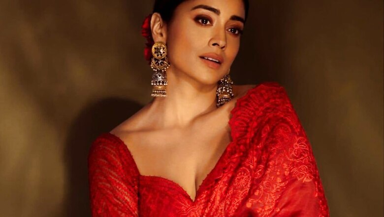 Shriya Saran Makes Heads Turn At Dishryam 2 Special Screening In A Red Saree