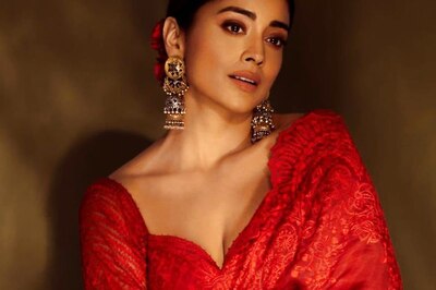 Shriya Saran Makes Heads Turn At Dishryam 2 Special Screening In A Red Saree
