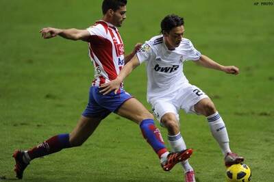 Higuain scores as Madrid beat Sporting