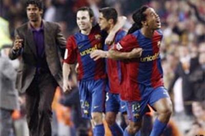 Barcelona score their way to top