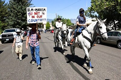Protesters met with jeers by crowd with guns in Nevada city