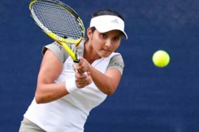 Paes crashes out, Sania stays afloat in doubles