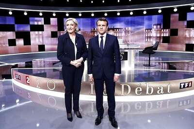 Macron, Le Pen Clash on Euro, Terrorism, in French Pre-Election TV Showdown