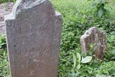 Woman dies next to own grave