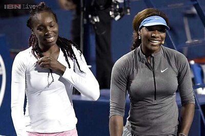 Williams sisters move into doubles quarters at US Open