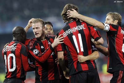 Milan, Madrid win in Champions League