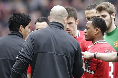 Dalglish defends Suarez after handshake snub