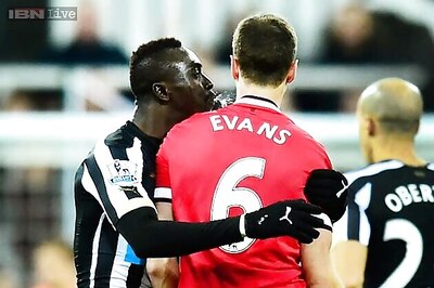 Papiss Cisse apologises for spitting row, Jonny Evans denies wrongdoing