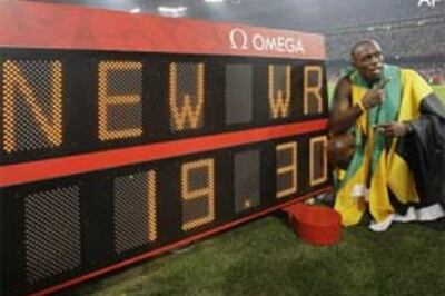 Record-breaking Bolt claims Olympic sprint double