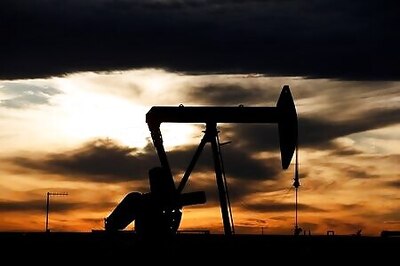 Oil prices inch lower as demand forecasts reduced, supply rises