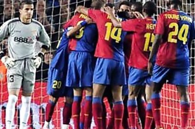 Barcelona stunned by Rubin, Lyon beat Liverpool